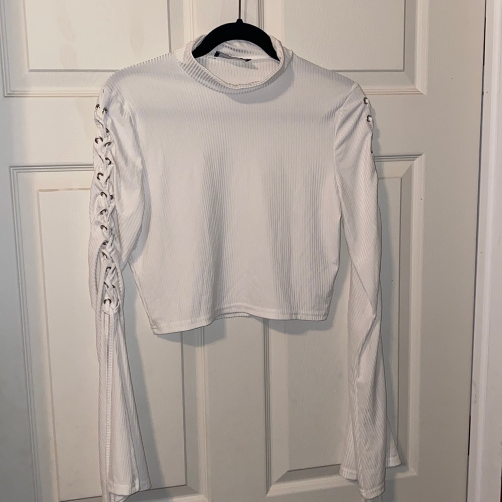 White crop top with flared sleeves and tie up detail